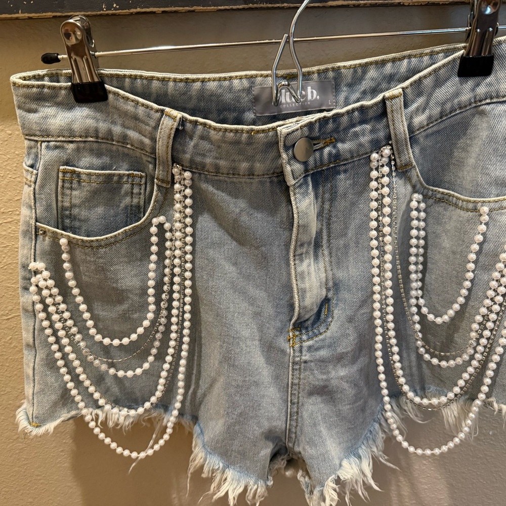 blue jean shorts with distressed hem and pearls